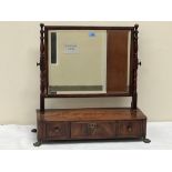 A George IV mahogany and line inlaid dressing table mirror, the bevelled rectilinear plate over base