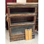 An oak sectional bookcase in three glazed parts, 34'w x 47½'h; the lot to include a Globe-