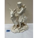 A 19th century porcelaneous group of the Welsh Taylor, he astride a ram with two kid goats in a
