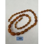 A necklace of graduated amber beads. 30' long. 78g gross