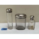 Three silver topped glass dressing table jars