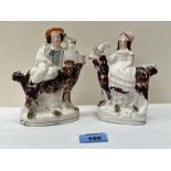 A pair of 19th century Staffordshire groups of children astride goats. 5¾' high