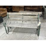 A wrought iron and wood slatted garden bench with scrolled arms. 54' wide