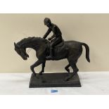 A heavy cast bronzed metal horse and jockey group. 15½' high