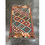 A Choli Kilim rug. 1.36m x 0.77m