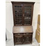 An oak bureau bookcase. 36'w x 77'h