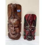 Two African carved wood masks, the larger 19' high