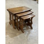 An Ercol nest of three occasional tables