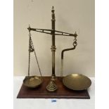 A set of 19th century gilt brass apothecary scales by H. Sutcliffe, Manchester, to weigh 2lbs