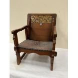 An early 20th century Arts and Crafts oak table bench with leather seat. Bears registration number