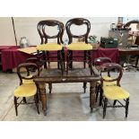 A Victorian walnut dining table, extending to 56' long with one extra leaf. Together with a set of