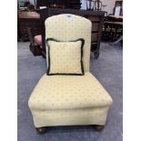 A 1920s Harrods bedroom chair upholstered in Colefax and Fowler fabric, with scatter cushions