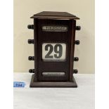 A 1920s oak desk calendar. 8' high