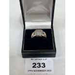 A silver and silver gilt diamond ring. 7g. Size N