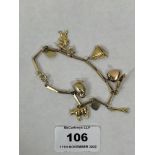 A 9ct charm bracelet. 11g