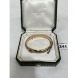 An antique gold foliate engraved hinged buckle bangle. Apparently unmarked. 20g gross