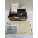 An R.A.F. pilots log book, related photographs, officer's mess ephemera etc.