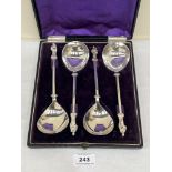 A late 19th century cased set of four white metal apostle spoons, 8' long. Apparently unmarked