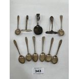 Eight silver coffee spoons; two silver infant's pushers and a silver spoon. 3ozs 8dwts