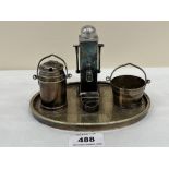An unusual plated cruet stand in the form of a village pump. 6¼' wide. Bears registration kite mark
