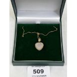 A 9ct diamond set heart pendant and necklet chain