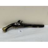 An early 19th century Turkish flintlock holster pistol with brass mounts. The barrel 10' long