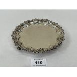 A Victorian silver waiter with shell moulded rim on volute feet. London 1895. 6'diam. 7ozs