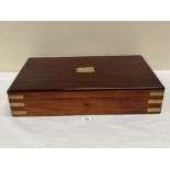 A Victorian mahogany and brass mounted box with velvet lined interior. 25' wide