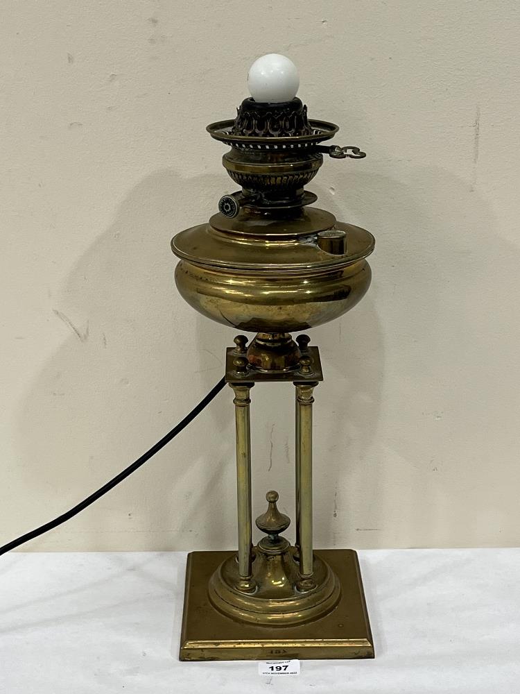 A 19th century Belgian 'Thermidor' patent 1893 brass oillamp base on four column support. 20'