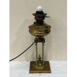 A 19th century Belgian 'Thermidor' patent 1893 brass oillamp base on four column support. 20'