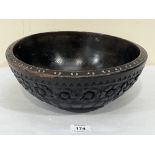 An antique carved treen bowl. 11¾' diam.