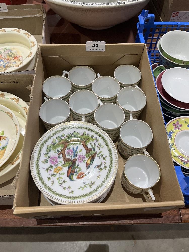 Ten coffee cans and saucers, painted in coloured enamels with peafowl. Gold anchor marks