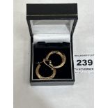 A pair of 9ct hoop earrings. 1.4g