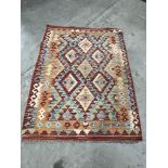 A Kilim rug. 55' x 41'