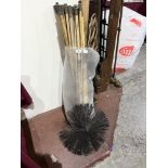 A bag of chimney sweep's rods with brush and carpet beater