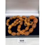 A necklace of graduated amber beads. 30' long. 78g gross