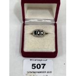 A 9ct sapphire and diamond ring. 2.7g gross. Size N