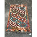 A Choli Kilim rug. 1.36m x 0.77m