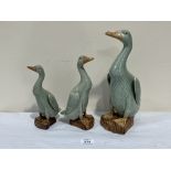 Three Chinese graduated celadon glazed geese. 8' - 12' high. Minor chips