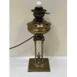 A 19th century Belgian 'Thermidor' patent 1893 brass oillamp base on four column support. 20'