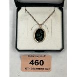 A 9ct pendant set with opal two birds and branch design, on necklet chain. 2g gross