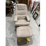 A reclining massage armchair with footstool