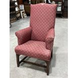 A George III style upholstered armchair. 19th century. Old repairs