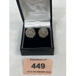 A pair of 18ct diamond cluster earrings, the point 5 stones untreated. Each earring 15mm diam.