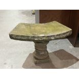 A stone garden seat or stand. 27' w x 17' h