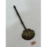 An 18th/19th century brass latten anointing spoon with shell cast bowl and knopped twist turned