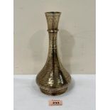 A 19th century Islamic brass vase with foliate wriggle-work decoration. 9¼' high