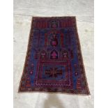 A Baluchi rug. 1.4m x 0.87m