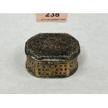 An 18th century brass snuffbox, the lid with inset pak panel carved with an animal. 2' wide. Hinge