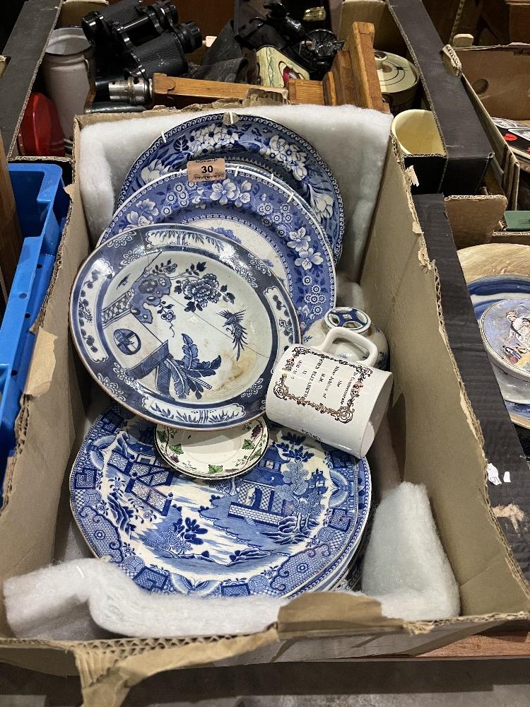 A box of blue and white flatware etc.